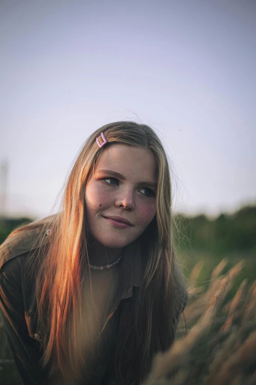  in a grassy field under an almost clear blue sky