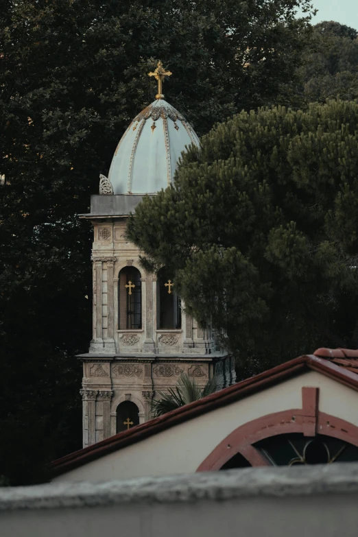 a church with a steeple has a cross in it