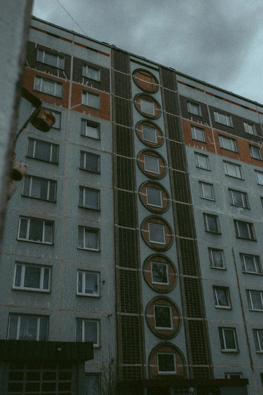 a building with a very large red sign on the side