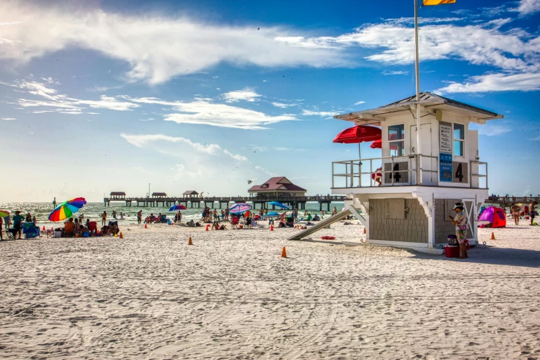 a lifeguard tower on a beach is shown