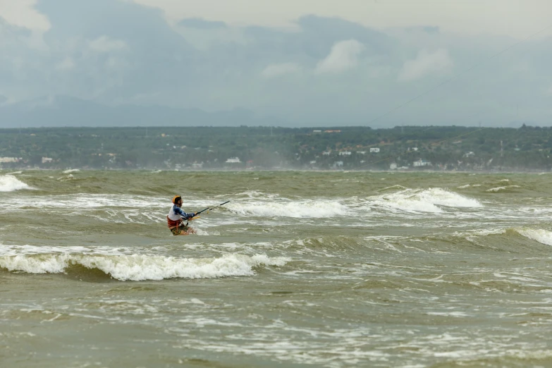 a person that is in the water with some surfboards