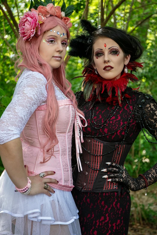 two women pose for a po outside with their costumes on