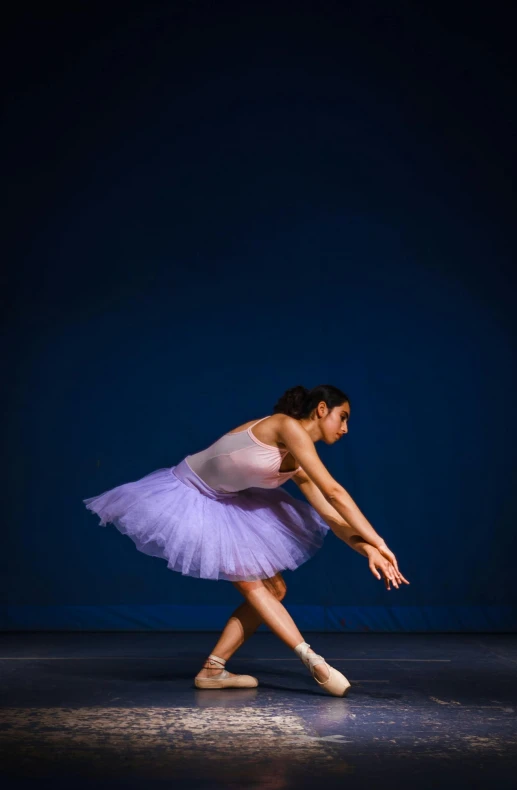 a woman is doing a trick on the ball