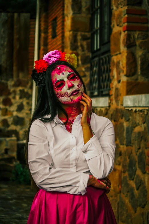 a woman in white shirt wearing pink and orange makeup