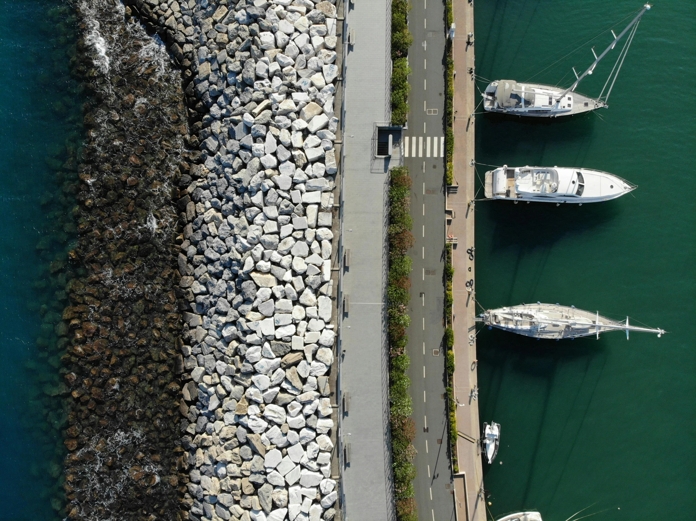 a couple of boats parked on the side of a road