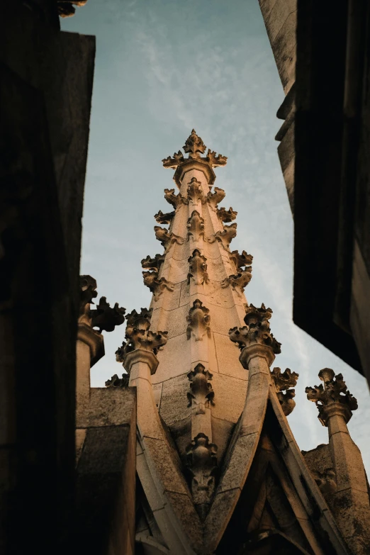 looking up at a very large building with a statue on top