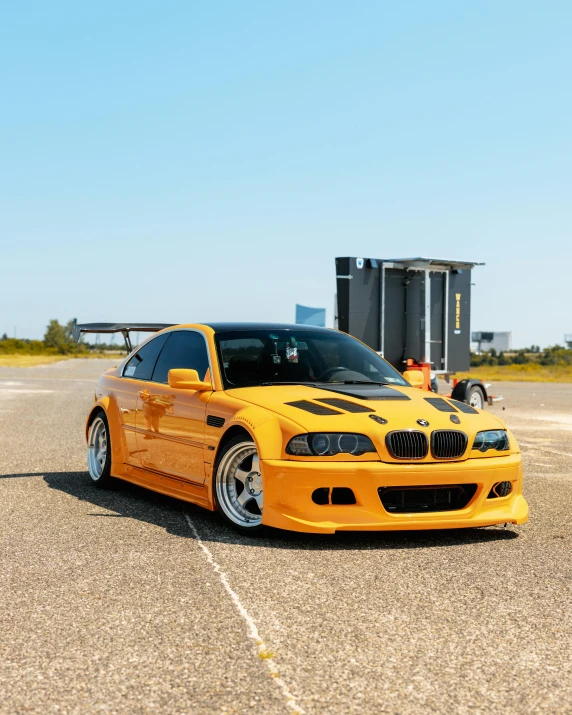 an orange car parked on a street