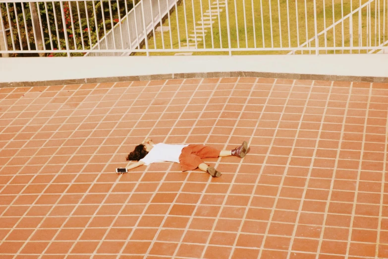 an image of a man laying on the ground