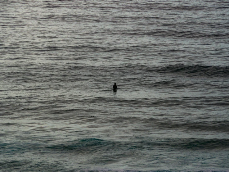 an object floating in the water with people out