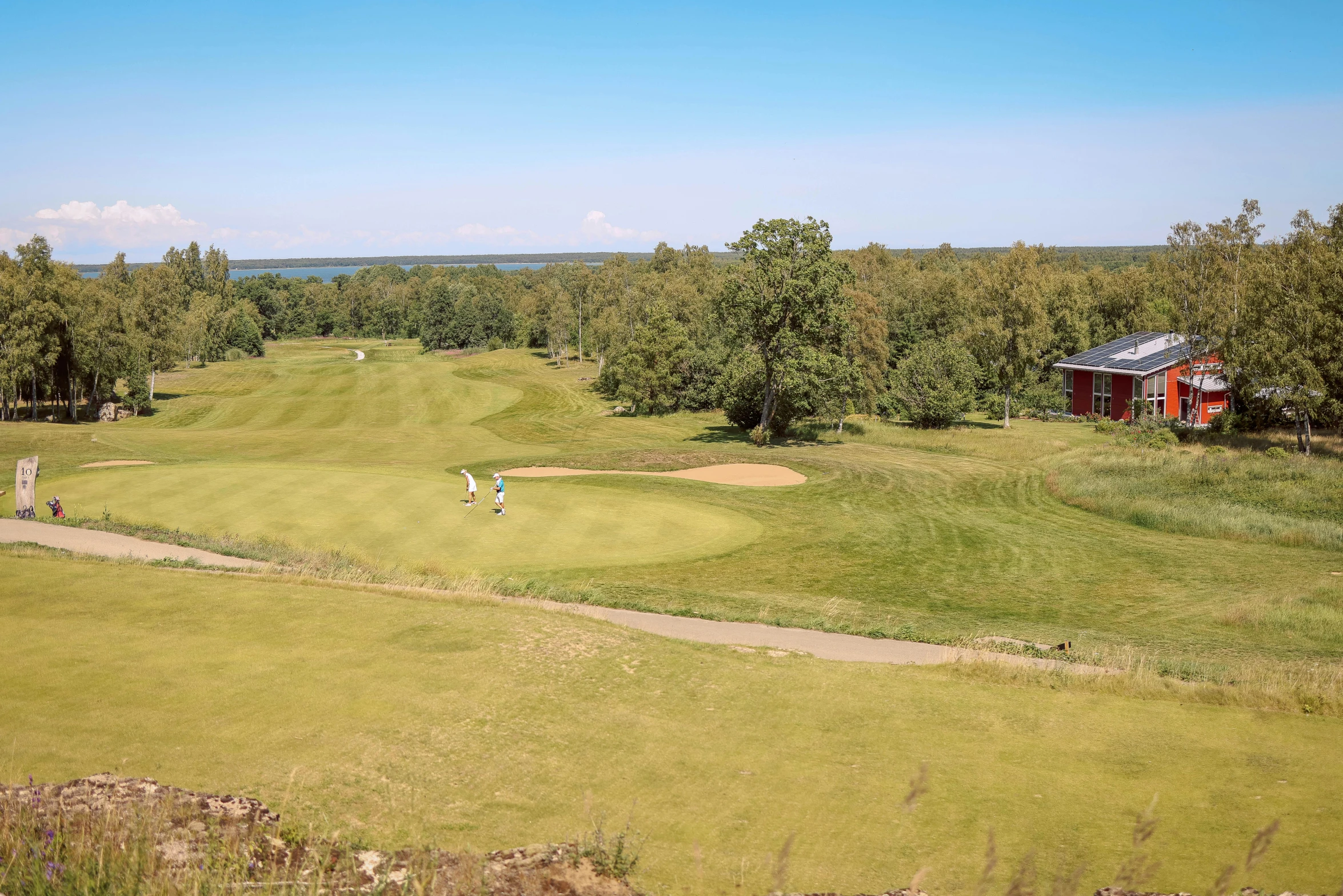 a large grassy golf course on a nice day