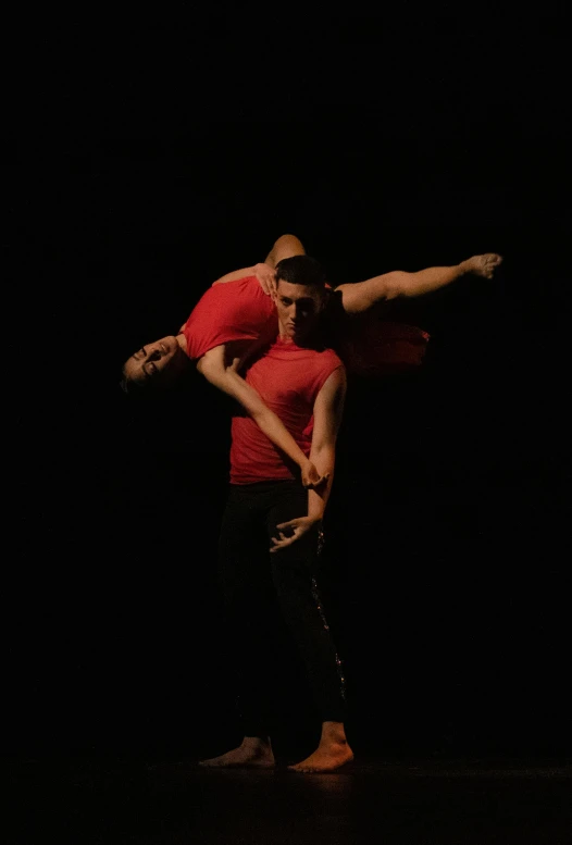 two men are performing dance with each other