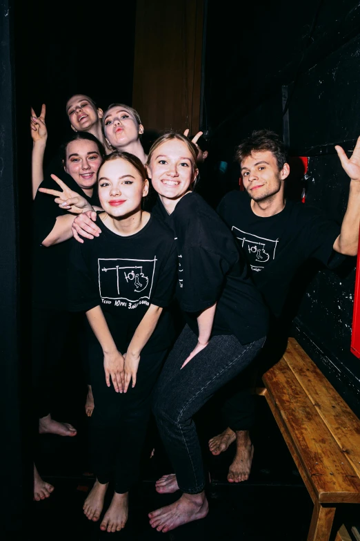 young people wearing tshirts taking selfie in bathroom