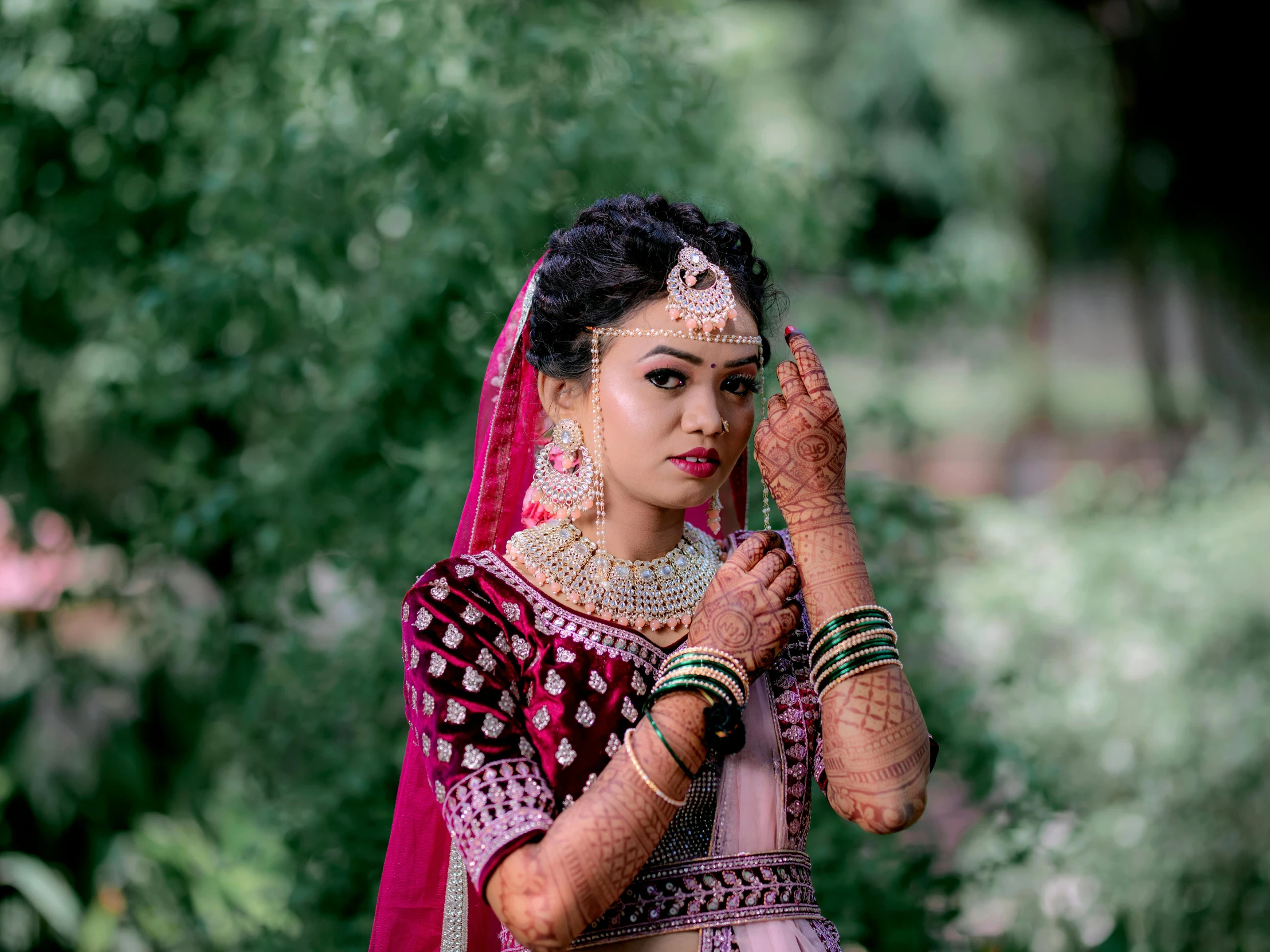 a bride holding her hands up to her face