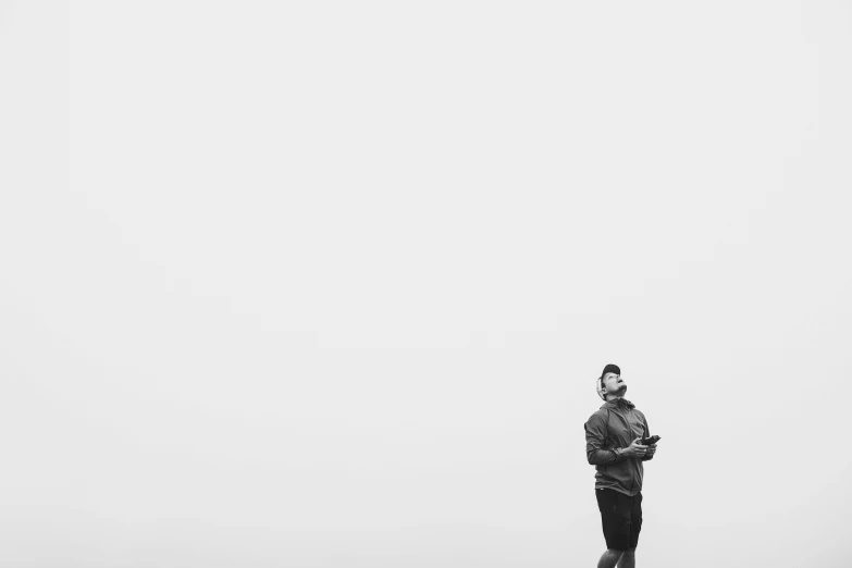 a person standing in the fog looking up