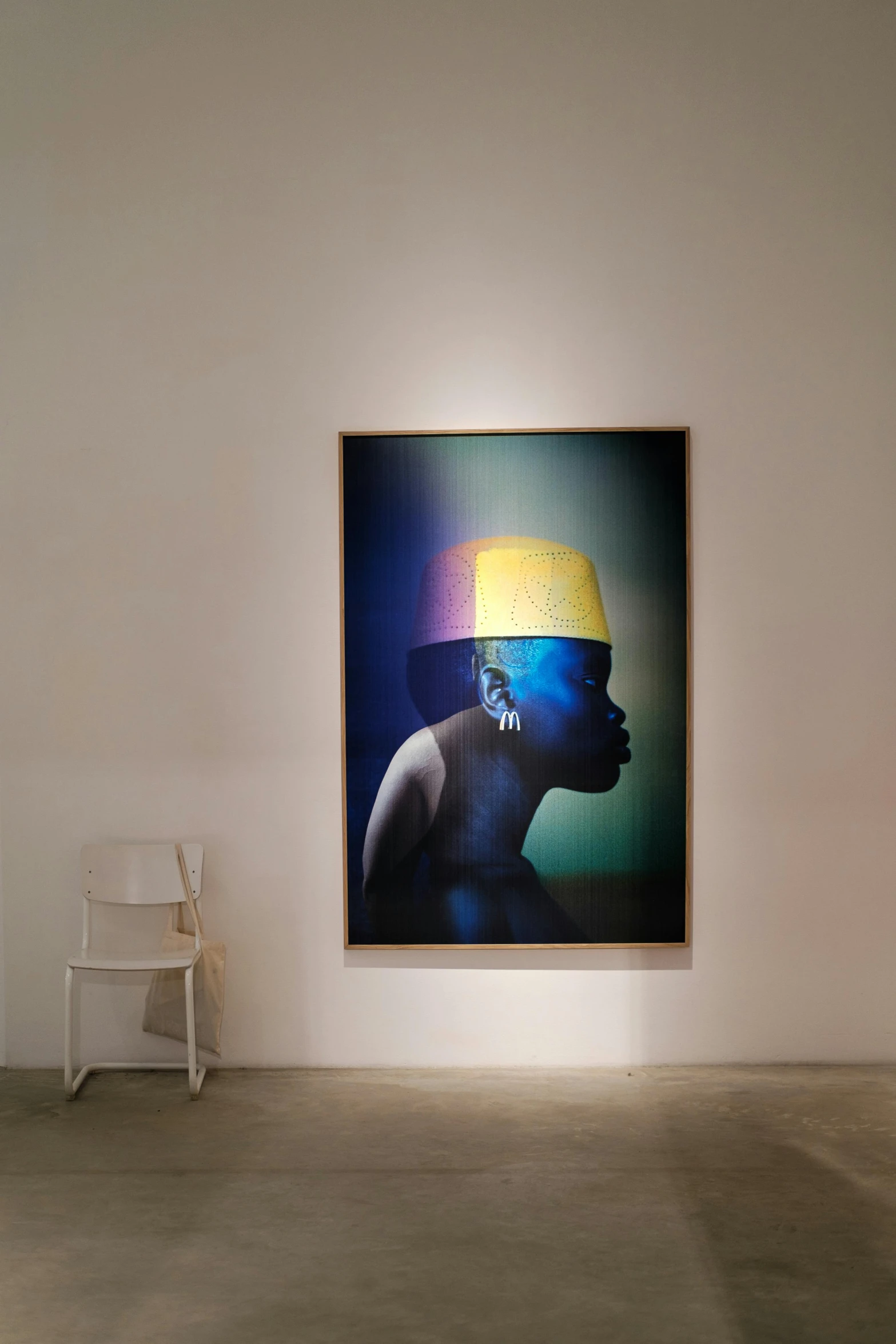 an african - american art work in a room with a chair