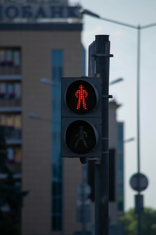 there is a signal light that has a man