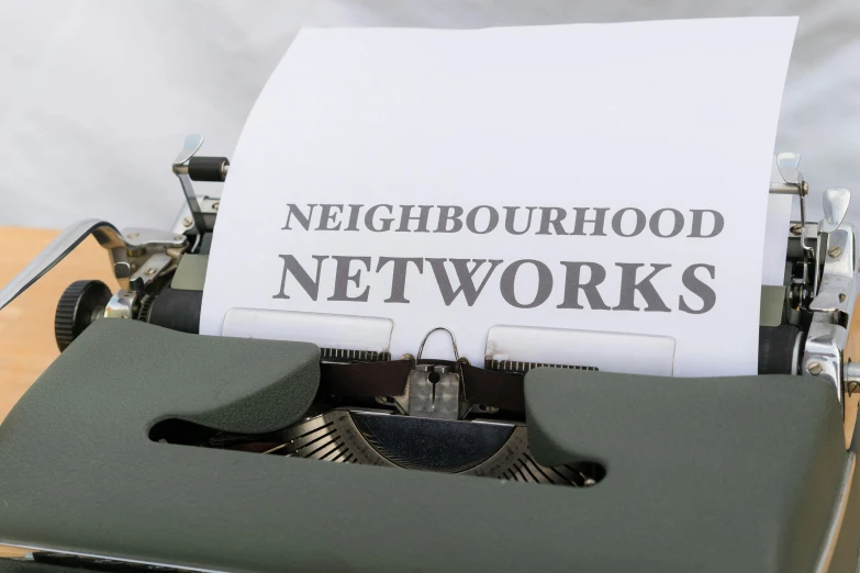 the text neighborhood network is written on an old fashioned typewriter