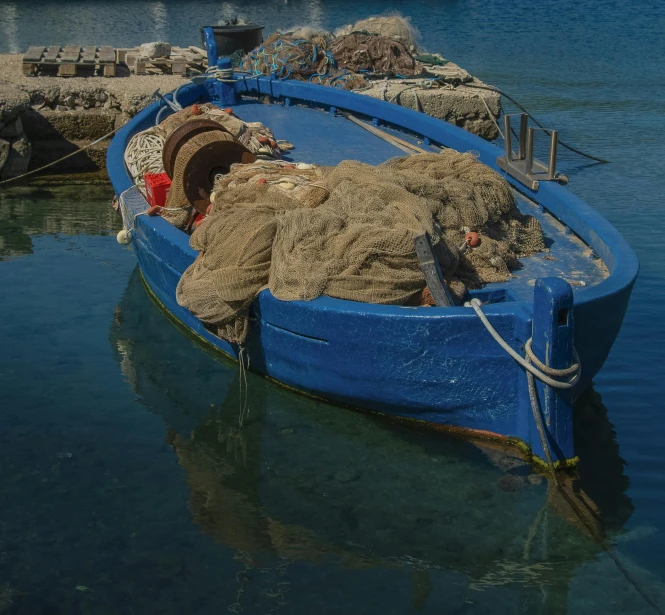 a large blue boat on a body of water