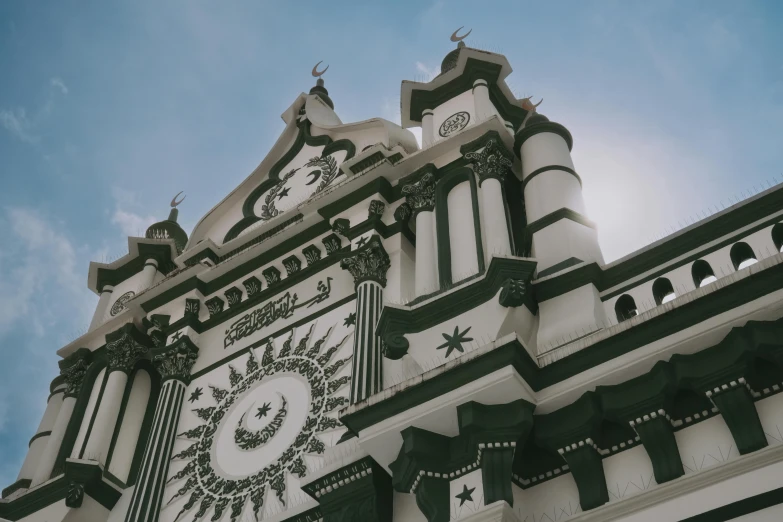 an ornate building has a clock on it's side