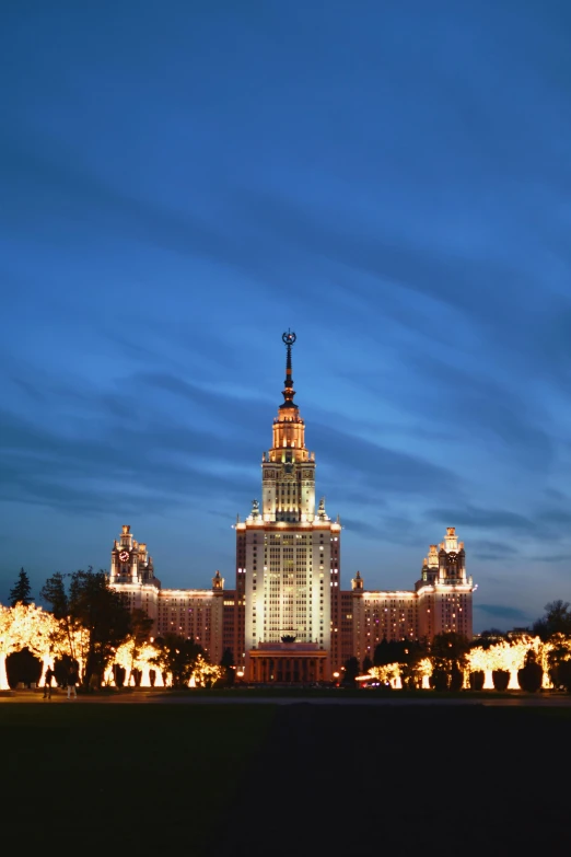 a building is lit up by the sky at night