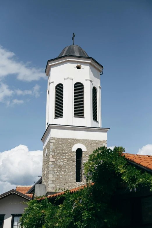 a large white building with a steeple and a clock on it