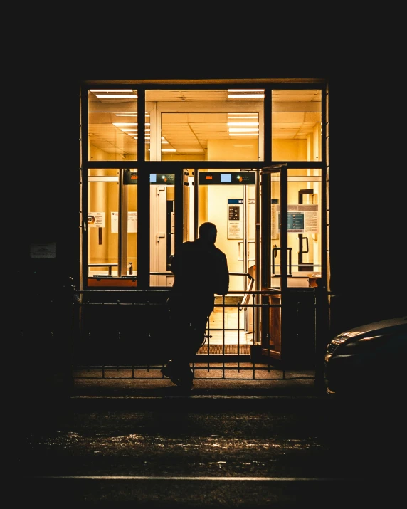 people sitting in an office building waiting to receive a phone call at night