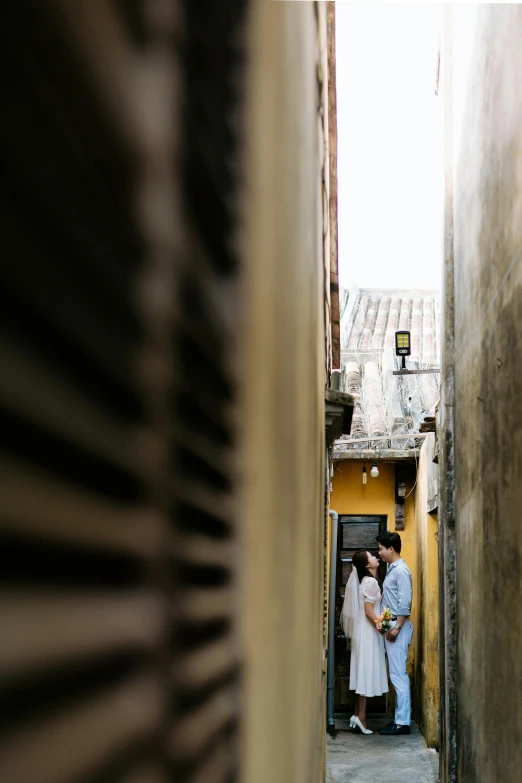 a man and woman that are standing in the doorway