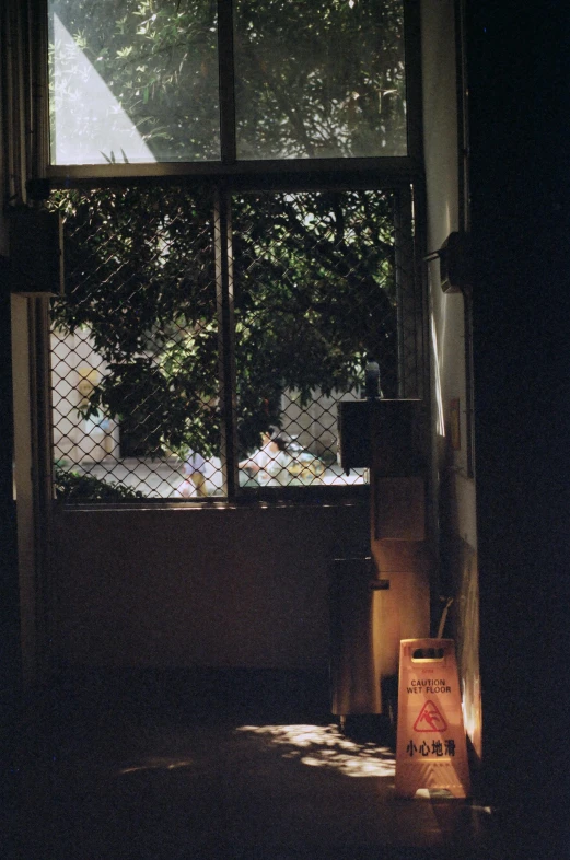 a dimly lit room shows an open window