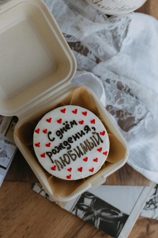 two decorated cookies that are in a container