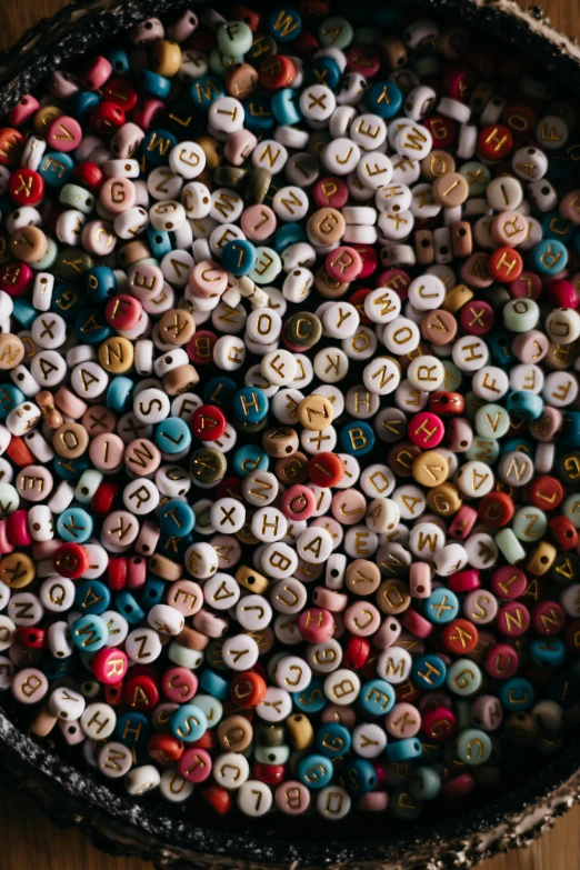 letters and numbers on a tray of small toys