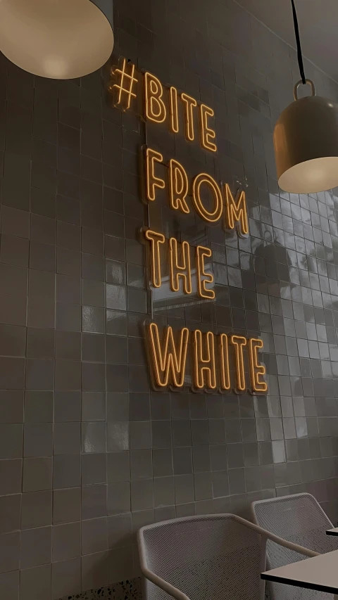 there is a neon sign on the wall of a restaurant