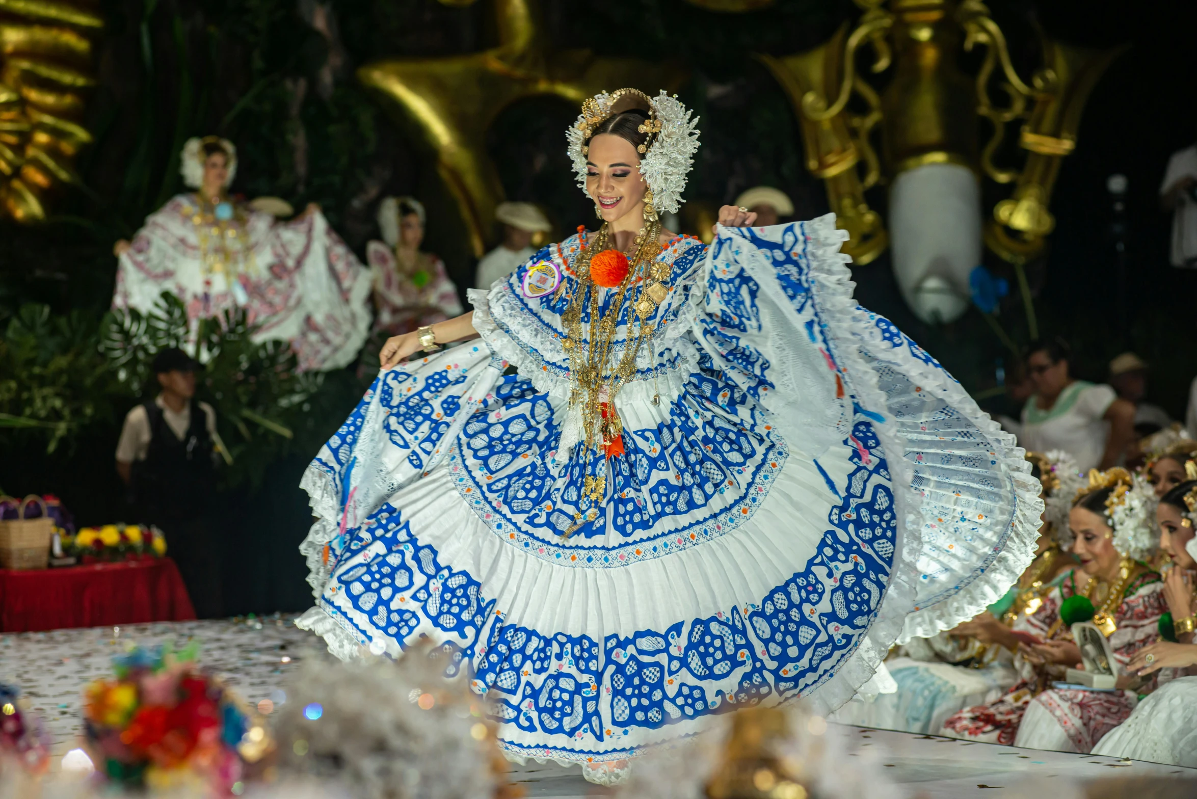 the woman in an elaborate costume is dancing