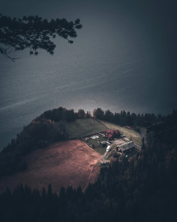 the lonely house sits on top of a hill