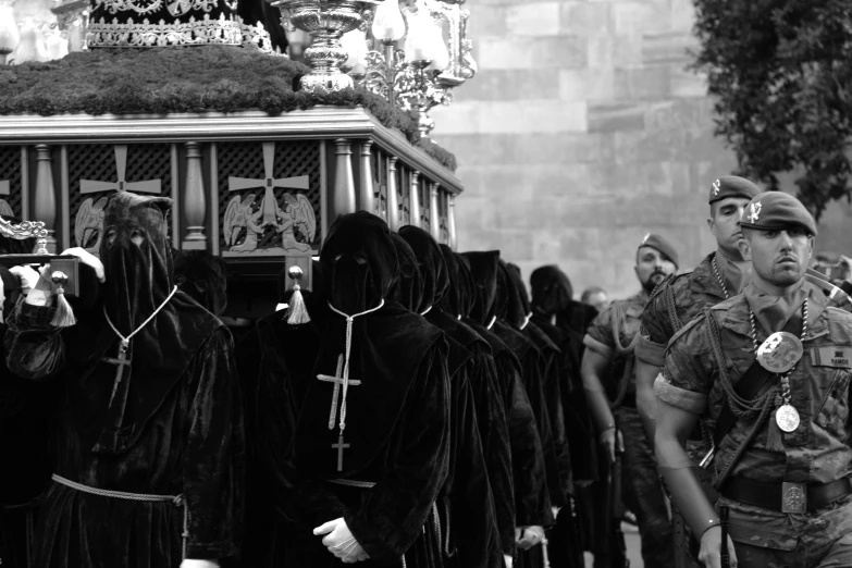 a group of people walking down a street in costume