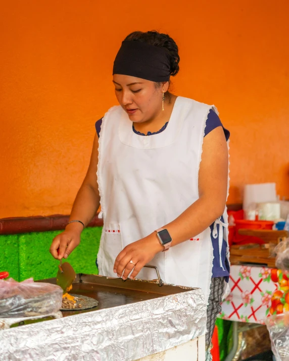 an image of a woman preparing food in a kitchen