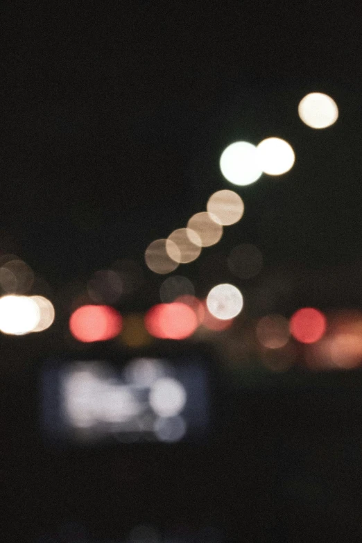 cars traveling at night on a highway, blurred background