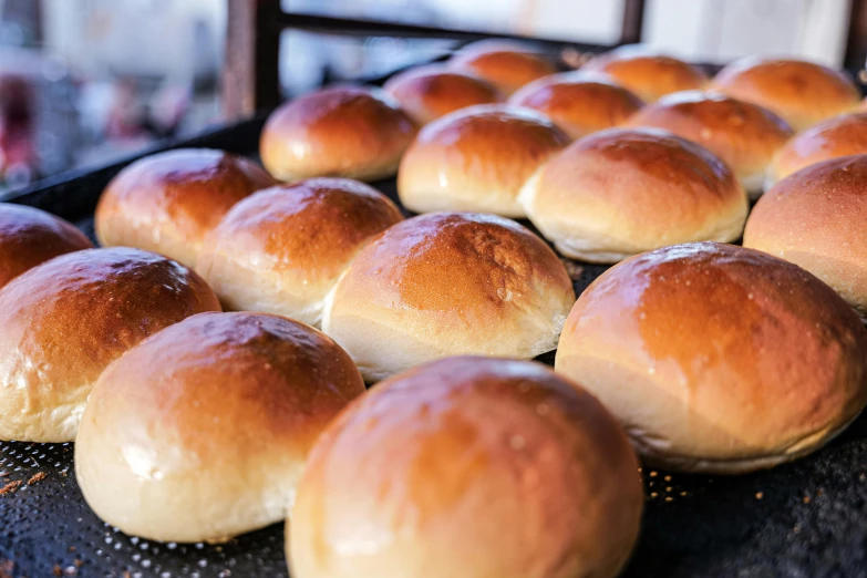 a close up of bread rolls on a pan