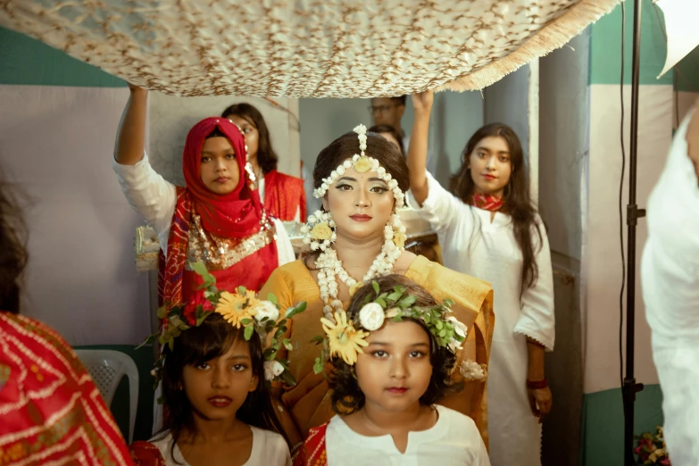 two girls and four girls wearing flower hair accessories