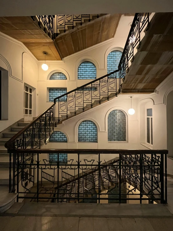 the stairs lead up to an atrium in this building