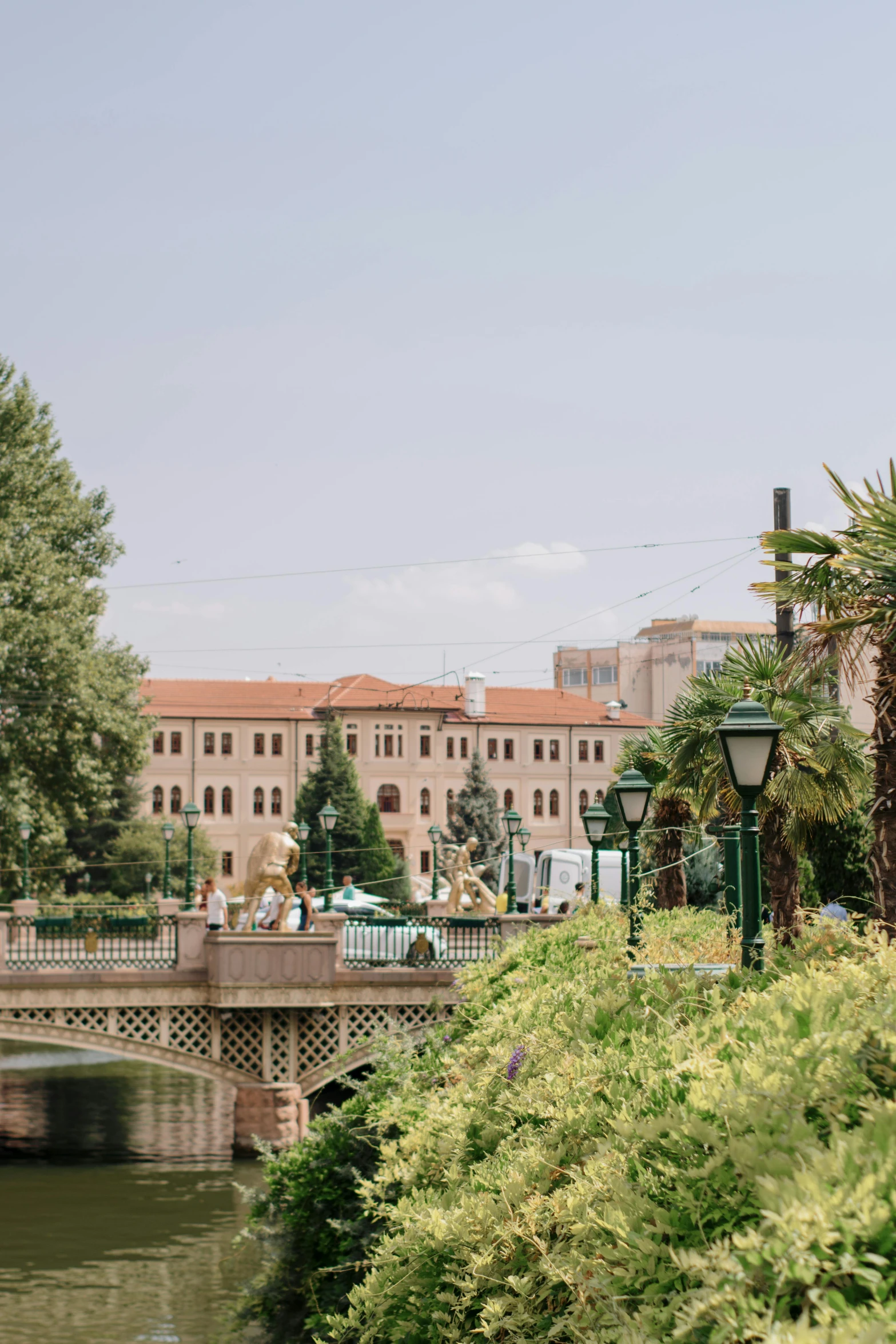 a bridge crossing a river near some buildings