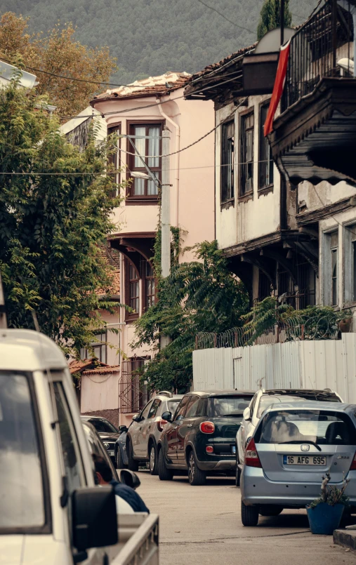 cars parked on the street near the building