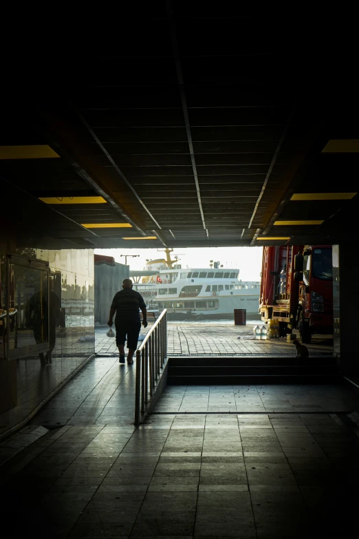 a man walks down the staircase outside of the terminal