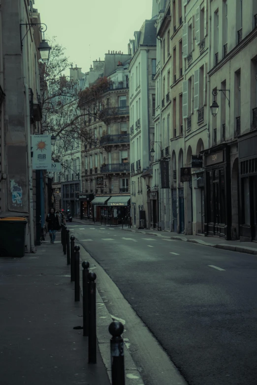 a quiet city street with the buildings of different eras