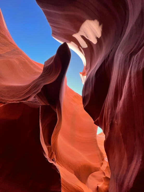 the sky is reflected on top of a canyon