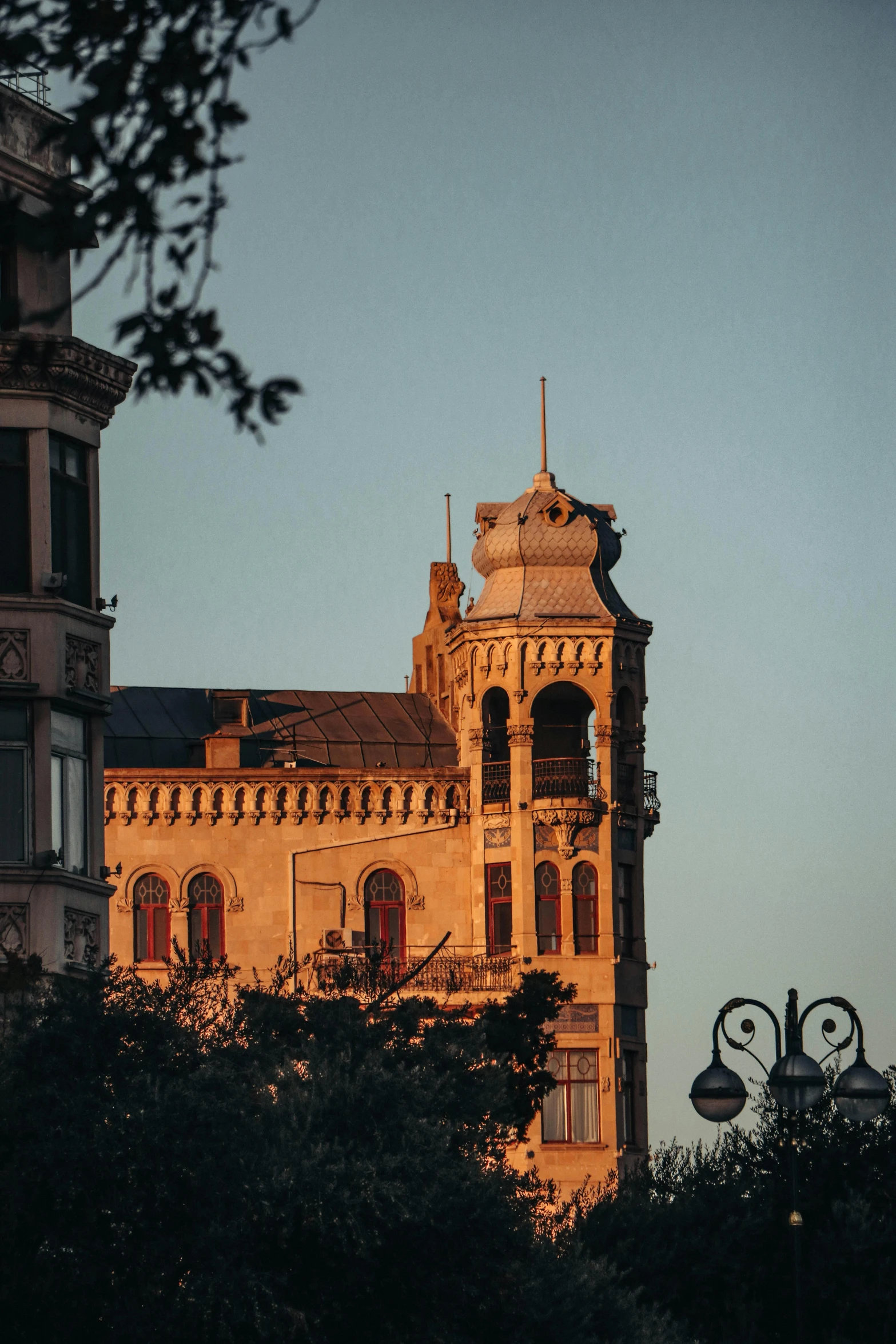 a large building with a clock tower behind it