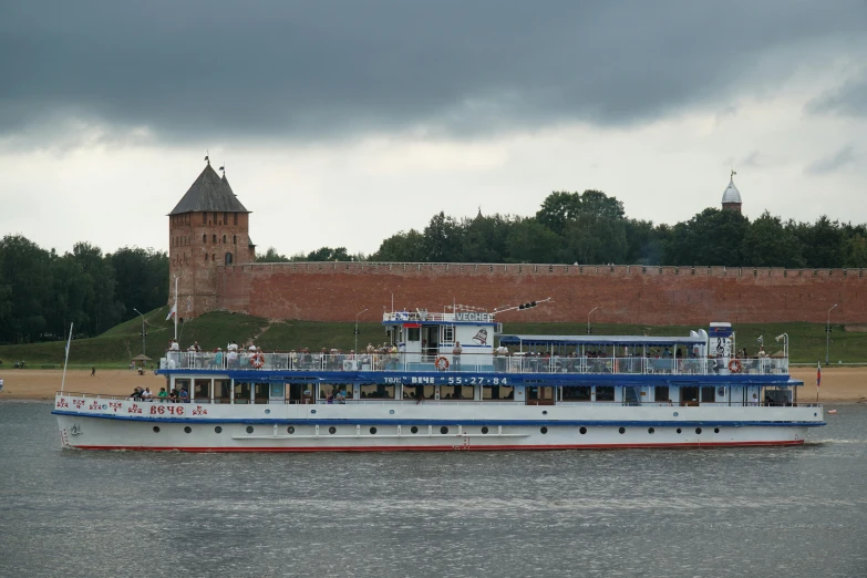 a large white boat traveling across a body of water