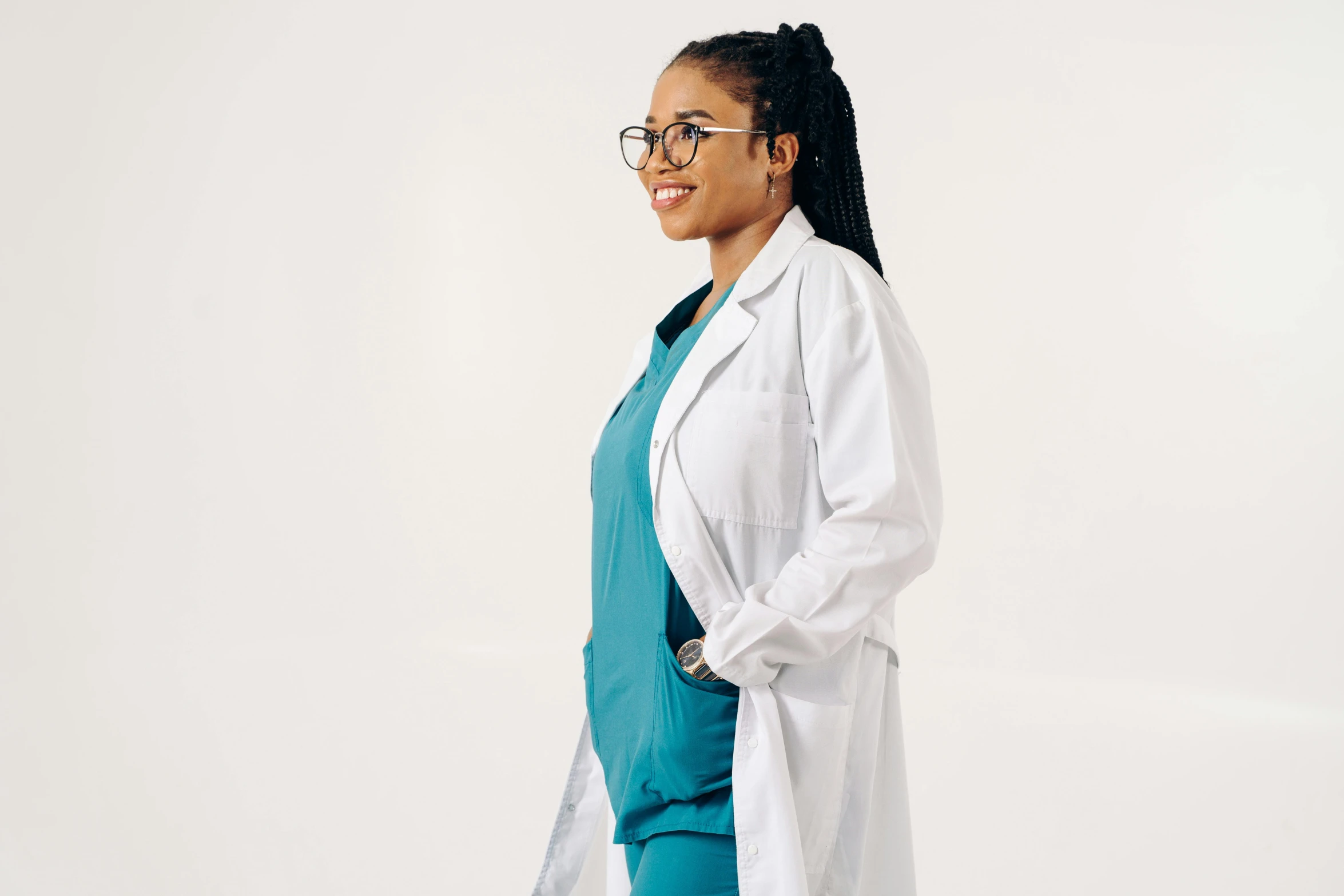 a woman wearing glasses is standing on a white background