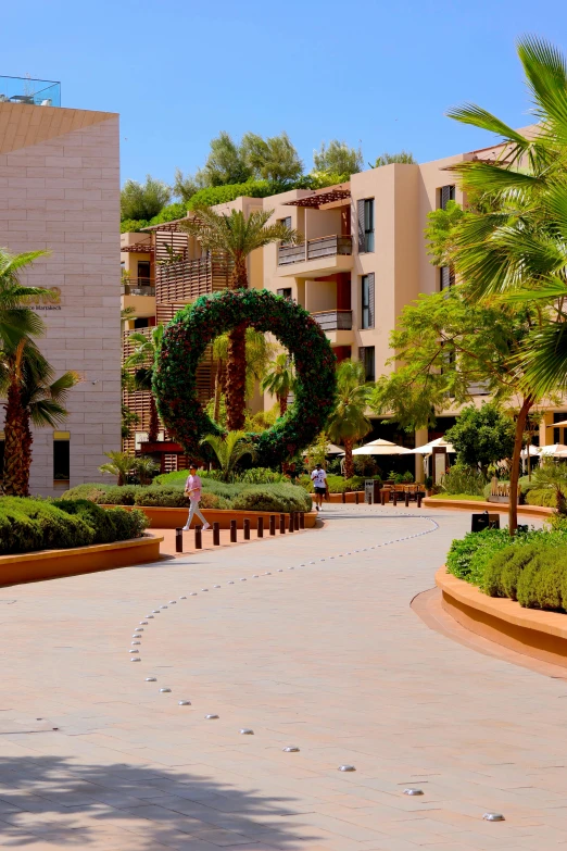 a building with a circular garden next to it