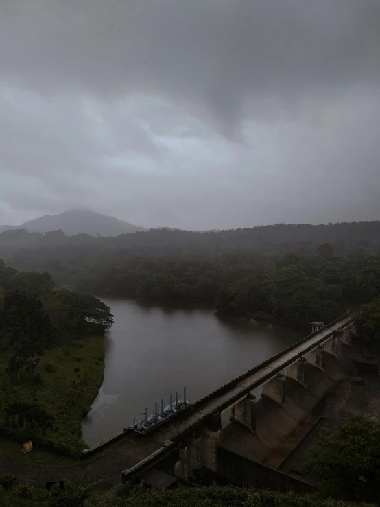 view from top of bridge on dark cloudy day