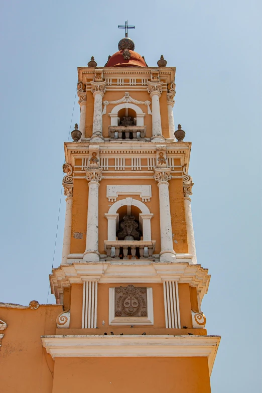 a bell tower with a bell at the top of it